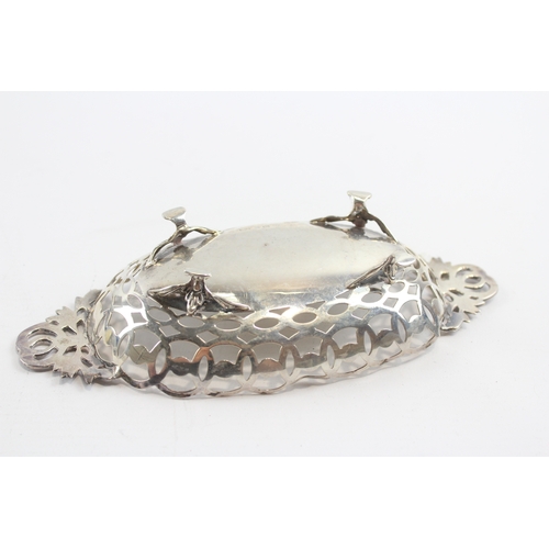 27 - An Edwardian silver oval pierced basket, Birmingham 1909, cast handles, 20cm, 106gm