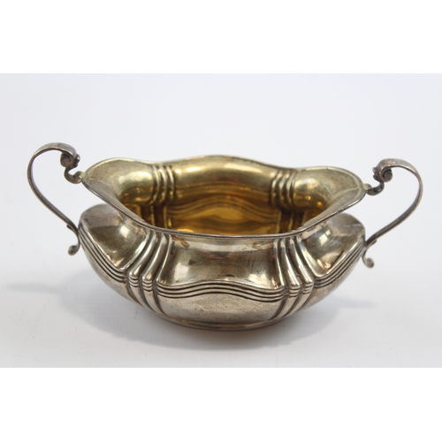 30 - A silver two handled sugar bowl, Sheffield 1908, 15.5cm across the handles, 107gm