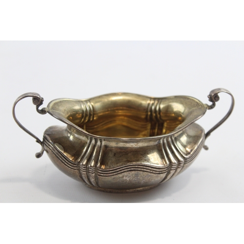 30 - A silver two handled sugar bowl, Sheffield 1908, 15.5cm across the handles, 107gm