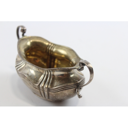 30 - A silver two handled sugar bowl, Sheffield 1908, 15.5cm across the handles, 107gm