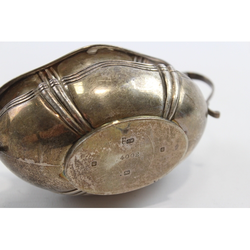 30 - A silver two handled sugar bowl, Sheffield 1908, 15.5cm across the handles, 107gm