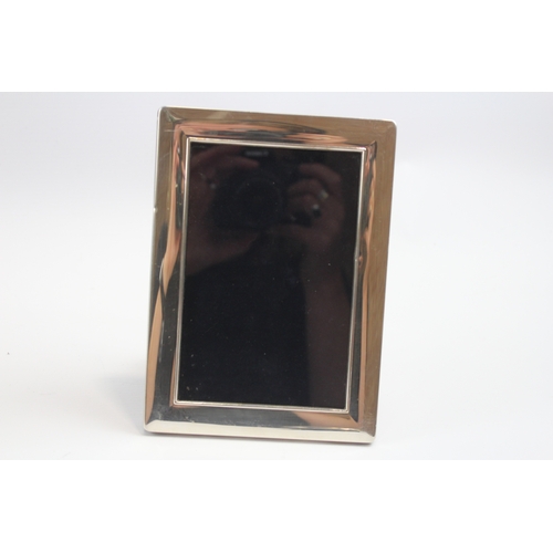 32 - A silver photograph frame, 18.5 x 13cm, Sheffield 2005  and two other silver frames.