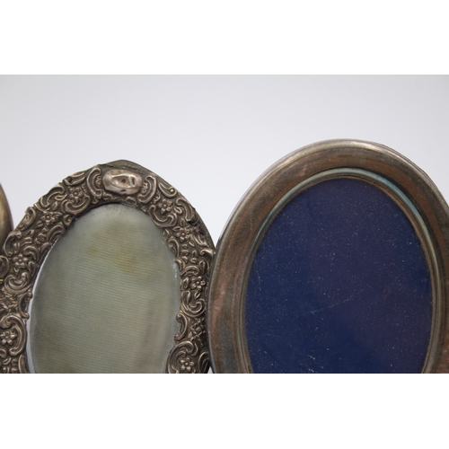 34 - An oval silver photograph frame, Sheffield 1984, 17 x 13cm and two other silver frames