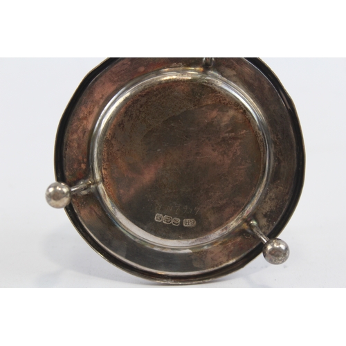 36 - A silver tea strainer on stand, Sheffield 1917, 10.5cm across handles, 79gm