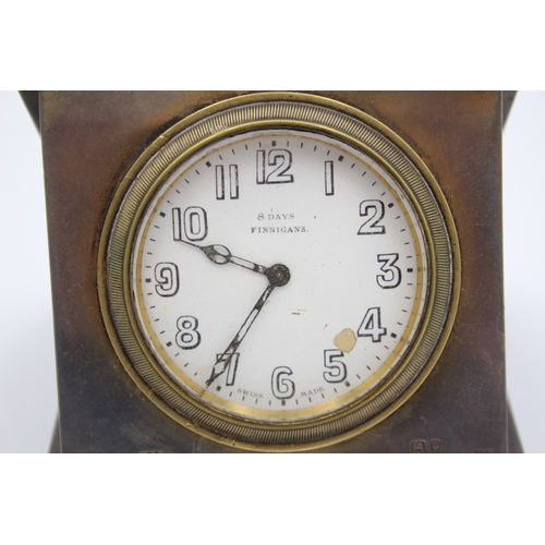 44 - A silver cased travelling 8 day bedside clock, London 1920, with engine turned decoration, 9.5 x 9.5... 