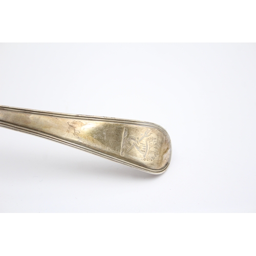 47 - A George III silver Old English and thread pattern soup ladle, London 1797, crested, 31cm, 165gm