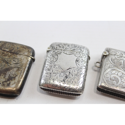 58 - Three silver vesta cases, Birmingham 1894,1928 and Chester 1900, 49gm