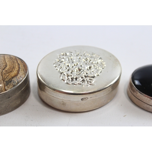 59 - A silver and hardstone pill box, Birmingham 2000, Millennium mark, 4 x 3 x 2cm and two other silver ... 