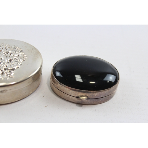 59 - A silver and hardstone pill box, Birmingham 2000, Millennium mark, 4 x 3 x 2cm and two other silver ... 