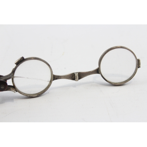 60 - A 19th century pair of unmarked silver and tortoiseshell lorgnettes, 6.5cm closed