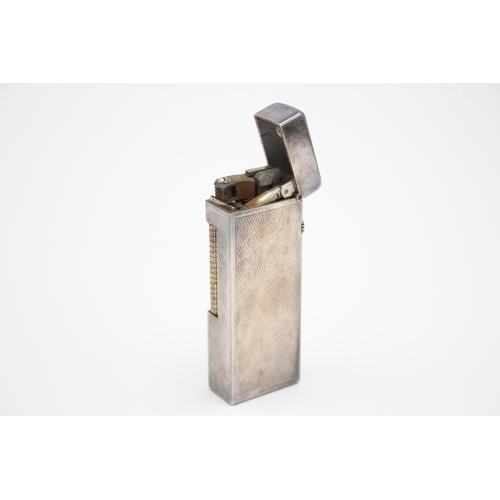 63 - Dunhill, a silver plated Rollagas cigarette lighter, case