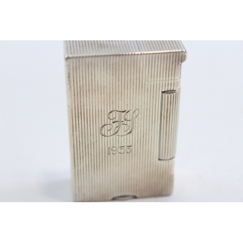 64 - A silver petrol lighter, Birmingham 1949, with ribbed decoration, engraved FS 1953, 5 x 3 x 1cm, 61g... 