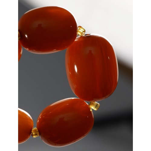 144 - A honey amber Bakelite graduated bead necklace, 23 - 10mm beads, 62cm, 51gm