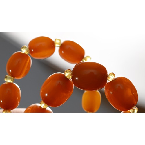 144 - A honey amber Bakelite graduated bead necklace, 23 - 10mm beads, 62cm, 51gm