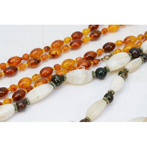 145 - A honey amber Bakelite graduated bead necklace, 27 - 10mm beads, 58cm, 86gm and other bead necklaces... 