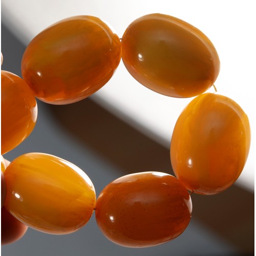 145 - A honey amber Bakelite graduated bead necklace, 27 - 10mm beads, 58cm, 86gm and other bead necklaces... 