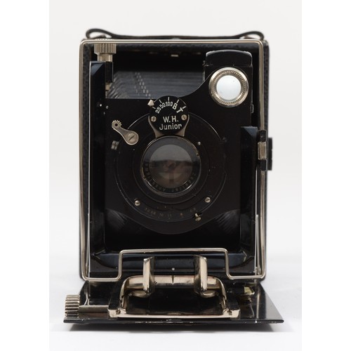 A W.H. Junior quarter plate folding camera, with a 135mm f6