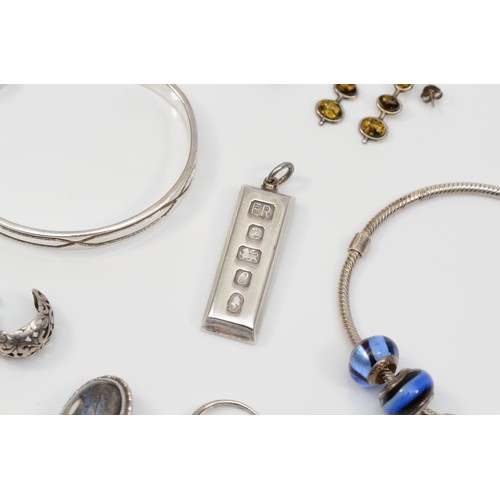 163 - A silver ingot pendant, a silver slave bangle and other silver jewellery, 92gm