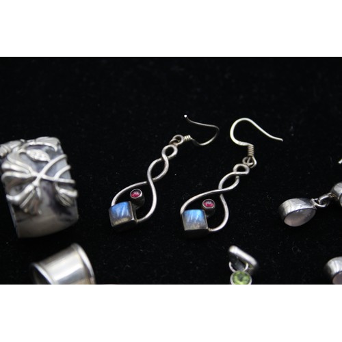 168 - Two silver and gemset pendants, three pairs of ear rings and a ring, 63gm