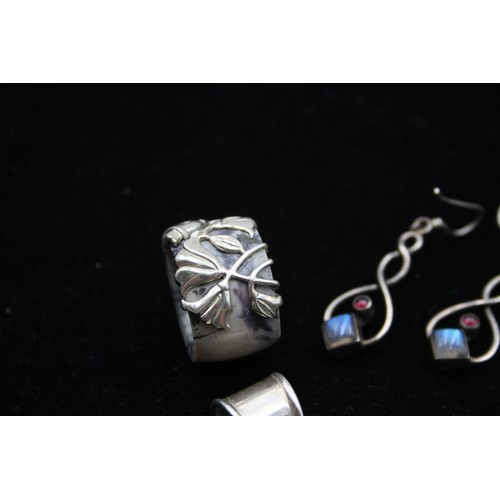 168 - Two silver and gemset pendants, three pairs of ear rings and a ring, 63gm