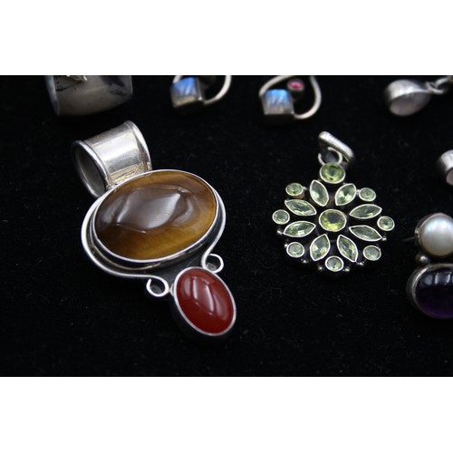 168 - Two silver and gemset pendants, three pairs of ear rings and a ring, 63gm