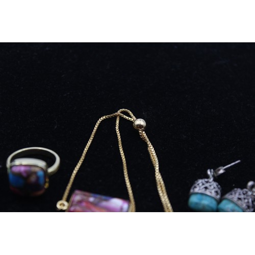 170 - A silver and turquoise pendant and ear ring set, and a silver gilt pendant and ring, 40gm