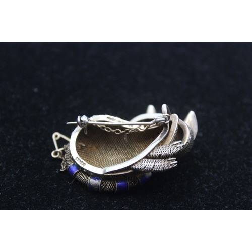 171 - A Chinese silver and enamel cat brooch, 36mm and a Chinese silver and tigers eye ring, 23gm