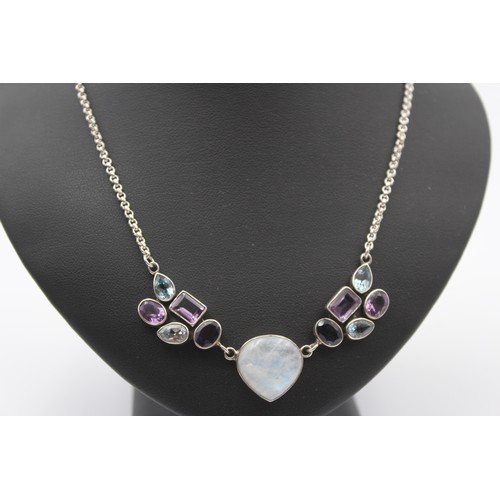 172 - A silver amethyst and topaz pendant and similar ear pendants, 25gm