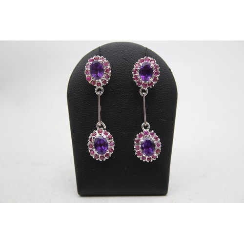 176 - A silver, amethyst and ruby suite of necklace, ear pendants and ring, 57gm