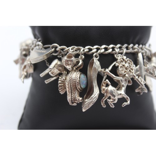 178 - A silver charm bracelet, 83gm