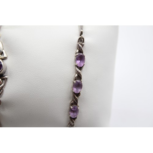 179 - Two silver and amethyst bangles, 26gm