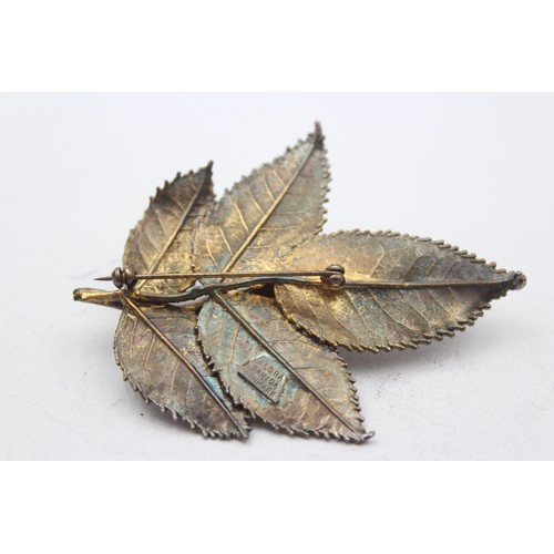 181 - Flora Danica, a Danish silver gilt rose brooch, 71mm and another in the form of a leaf.