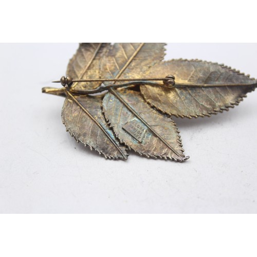 181 - Flora Danica, a Danish silver gilt rose brooch, 71mm and another in the form of a leaf.