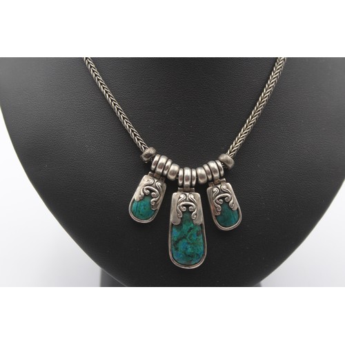 184 - A silver and turquoise matrix type of stone necklace and ear rings, 56gm