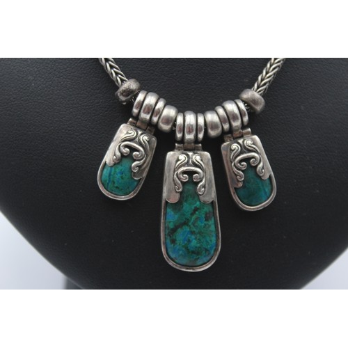 184 - A silver and turquoise matrix type of stone necklace and ear rings, 56gm