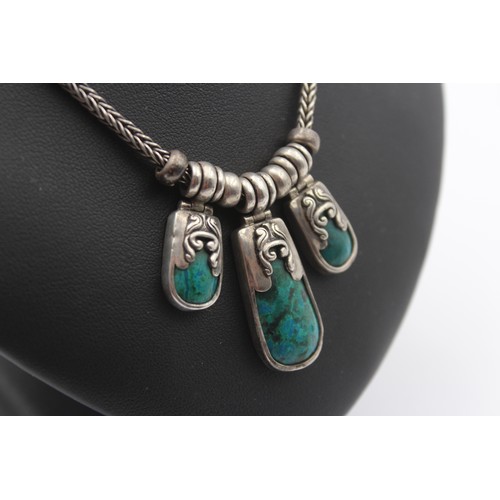 184 - A silver and turquoise matrix type of stone necklace and ear rings, 56gm