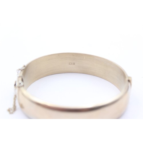 186 - A silver gilt hinged bangle, Birmingham 1970, 30gm