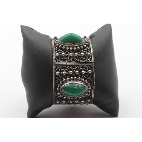 195 - A low grade silver and green cabochon bracelet, control marks, 16.5cm, 76gm