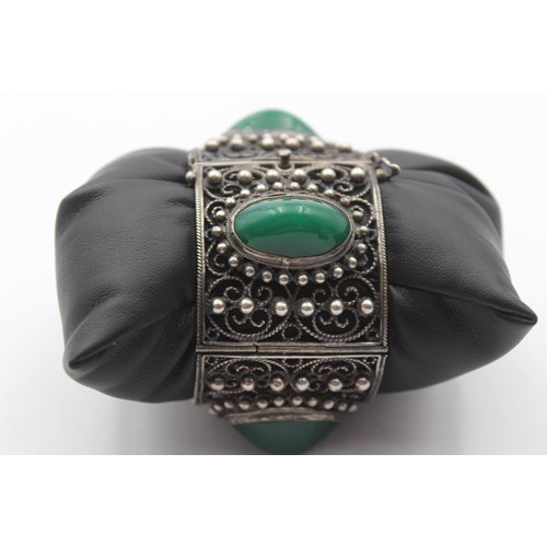 195 - A low grade silver and green cabochon bracelet, control marks, 16.5cm, 76gm