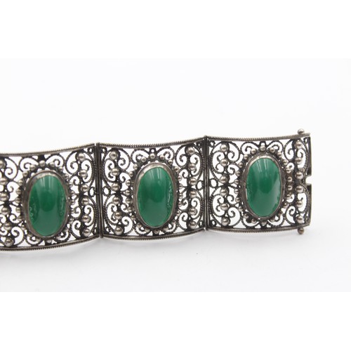 195 - A low grade silver and green cabochon bracelet, control marks, 16.5cm, 76gm