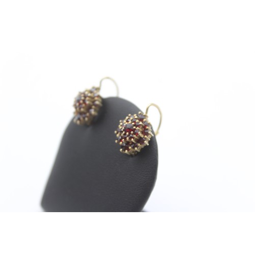 204 - An Austrian 900 standar silver gilt and Bohemian garnet cluster bracelet and ear rings, 17.5cm, 27gm