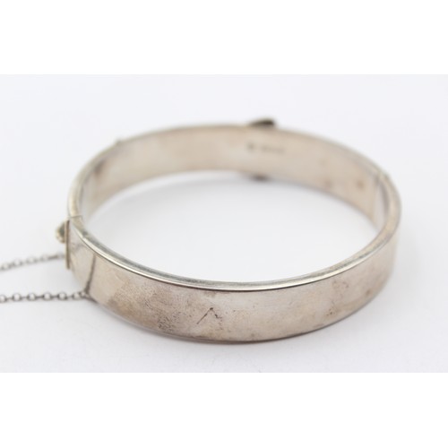 205 - A vintage silver hinged buckle bracelet, Birmingham 1964, 12mm wide, 64 x 57mm, 24gm