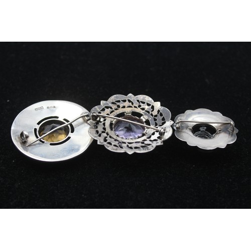 216 - A Victorian silver and hardstone pebble brooch, one vacant, 32mm, a silver and citrine brooch and a ... 