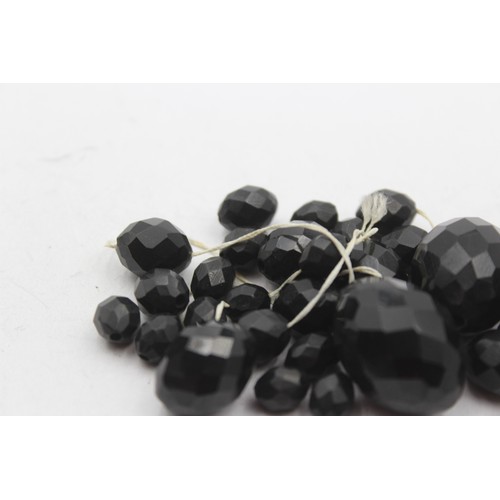 217 - A Victorian faceted Whitby Jet graduated necklace, the largest 30mm, needs restringing