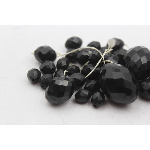 217 - A Victorian faceted Whitby Jet graduated necklace, the largest 30mm, needs restringing