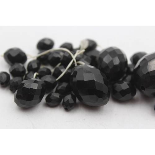 217 - A Victorian faceted Whitby Jet graduated necklace, the largest 30mm, needs restringing