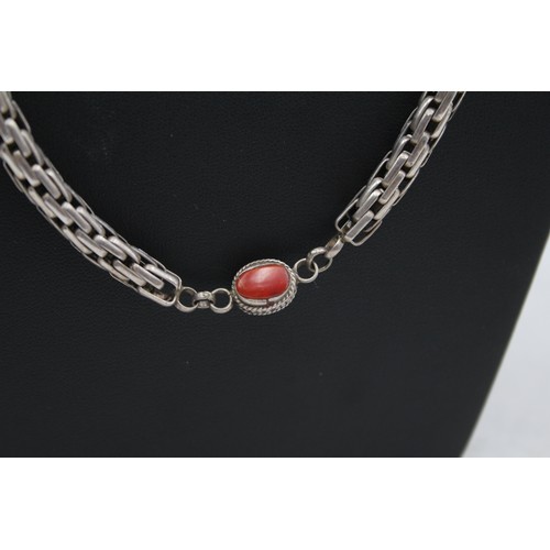 220 - An unmarked silver and coral necklace, 65cm, 65gm