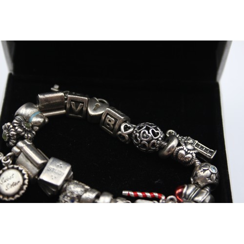 222 - Pandora, a silver charm bracelet, 83gm, box