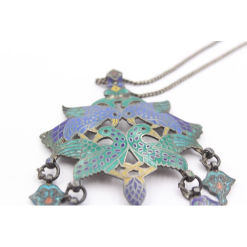 224 - Murlidhar Multan, an Indian Rupee silver and enamel bird pendant, 8 x 6cm, chain, 42gm