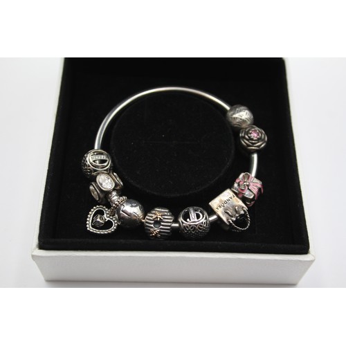 226 - Pandora, a silver charm bracelet, 36gm, cbox.